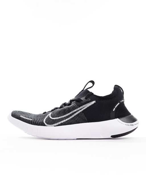 Nike Free Run Flyknit sneakers in black and white