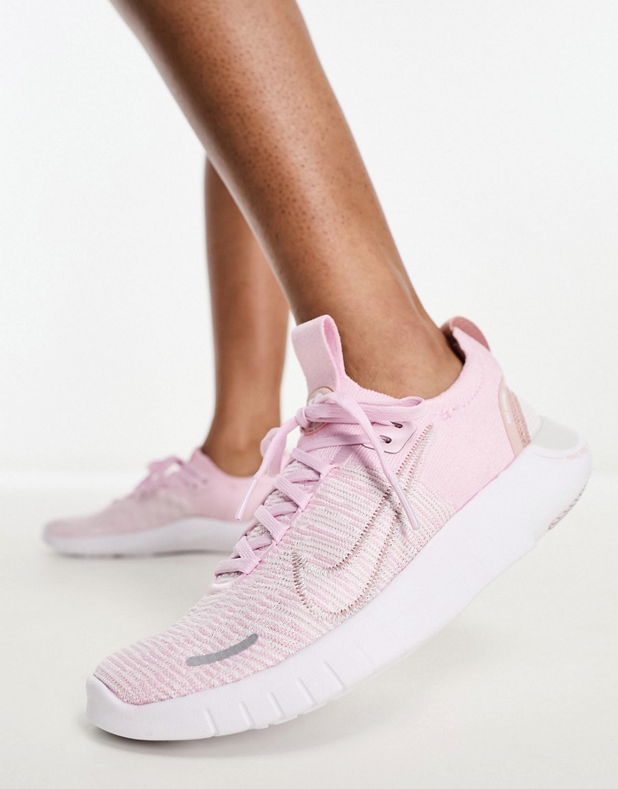 Shop Nike Free Run Flyknit Sneakers In Pink