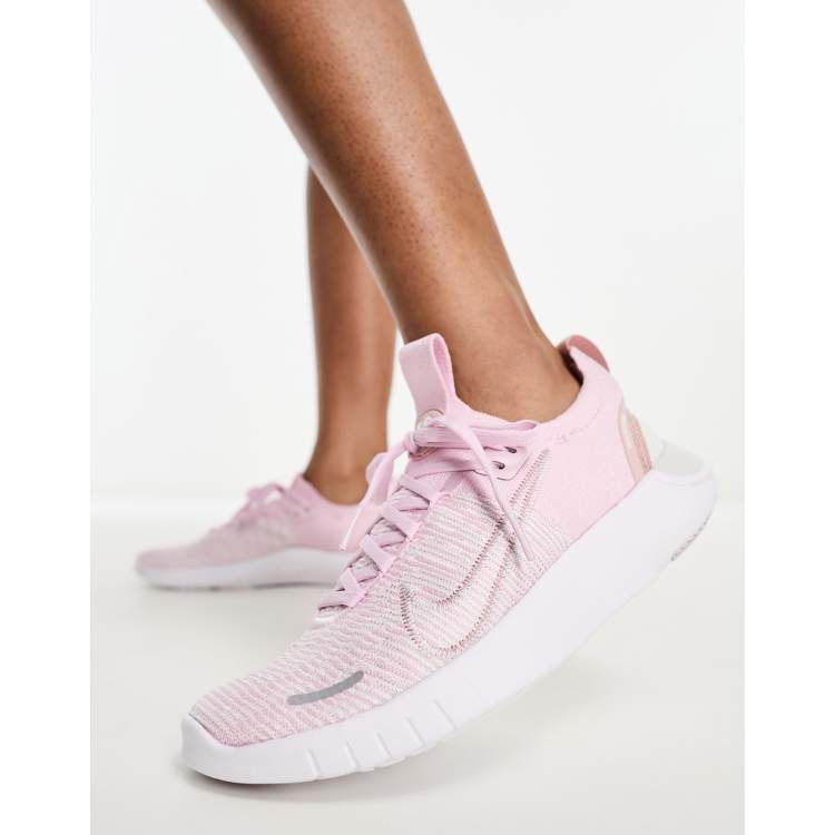 Nike Free Run Flyknit sneakers in pink