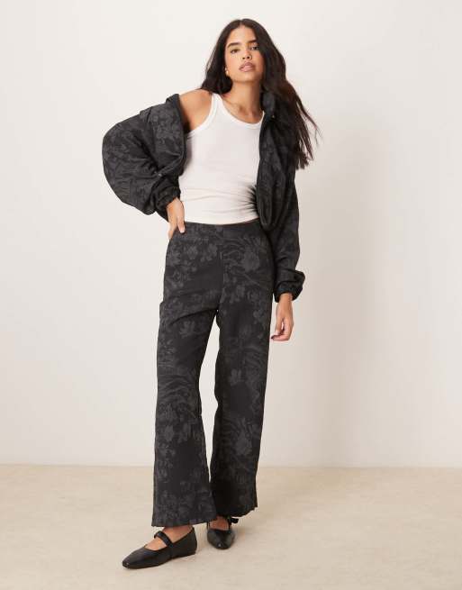 Nike full zip jacquard print track jacket in black | ASOS