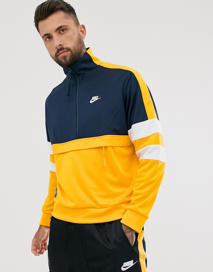 Nike - Geweven overhead jack in geel en marineblauw