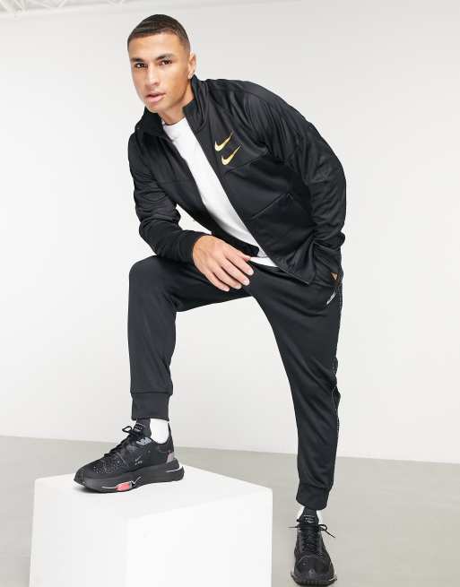 Giacca nike nera store e oro