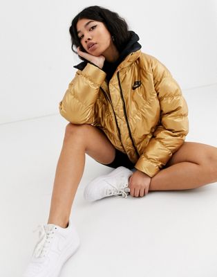 Nike gold high neck padded jacket | ASOS