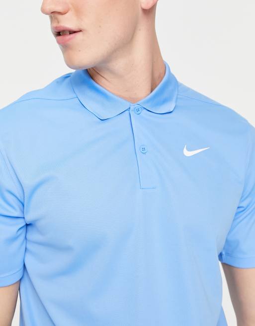 Light blue on sale nike golf shirt