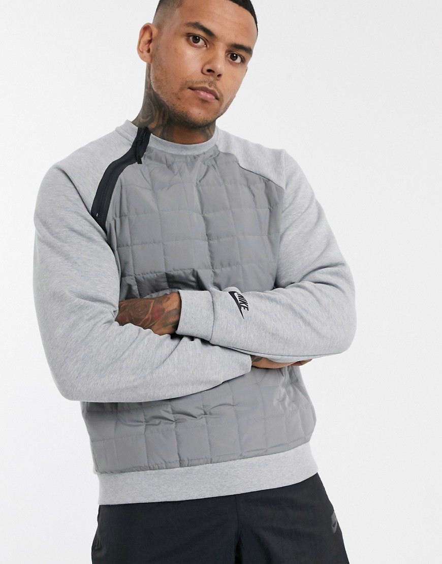 Nike - Grå rundhalset vinter-sweatshirt med vatterede paneler og asymmetrisk lynlås