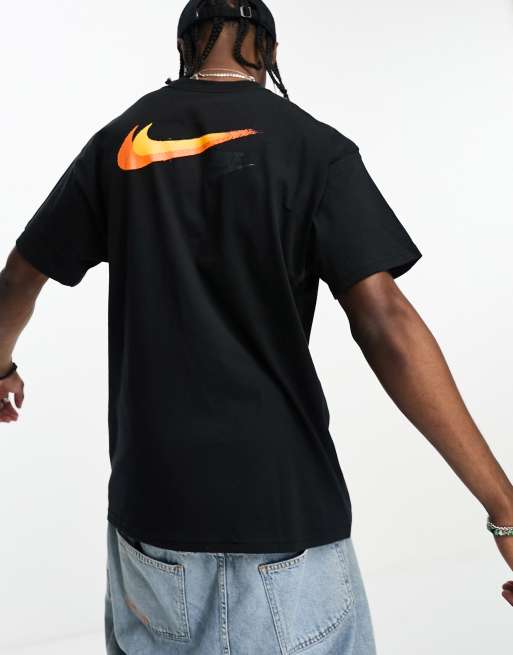 Black nike shirt store with orange swoosh