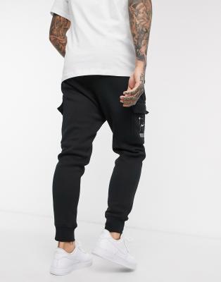 nike swoosh logo cuffed joggers in black