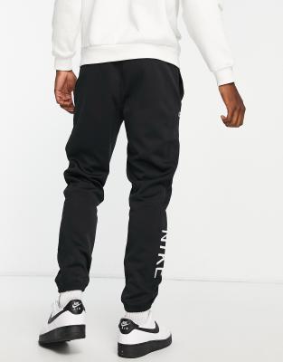 Nike Day logo poly knit pants in black 