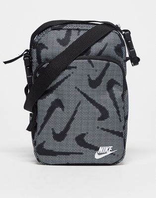 Nike Heritage cross body bag in black with all over logo