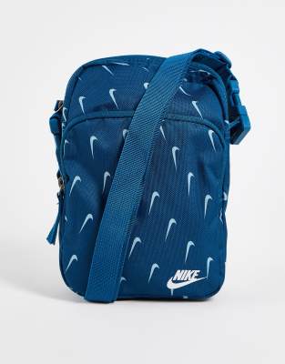 Nike Heritage cross body bag with all over logo print in blue