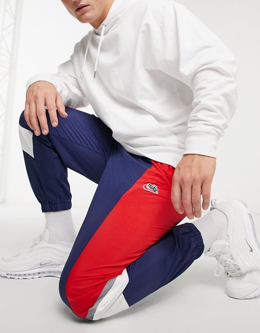 Nike Heritage Essentials Windrunner woven cuffed joggers in navy/red | ASOS