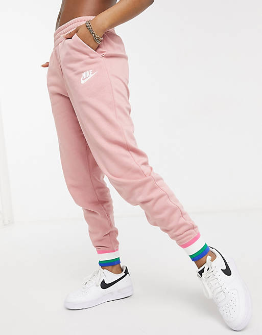  Nike heritage fleece joggers in rust pink and striped cuffs 