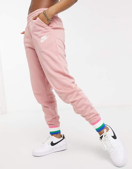 Nike heritage fleece joggers in rust pink and striped cuffs | ASOS