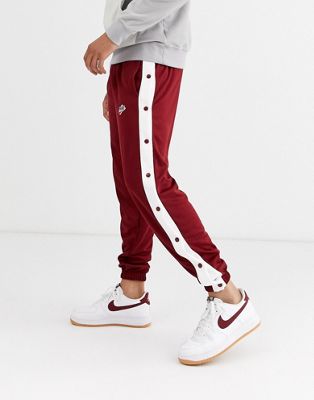 Nike Heritage popper joggers in red | ASOS