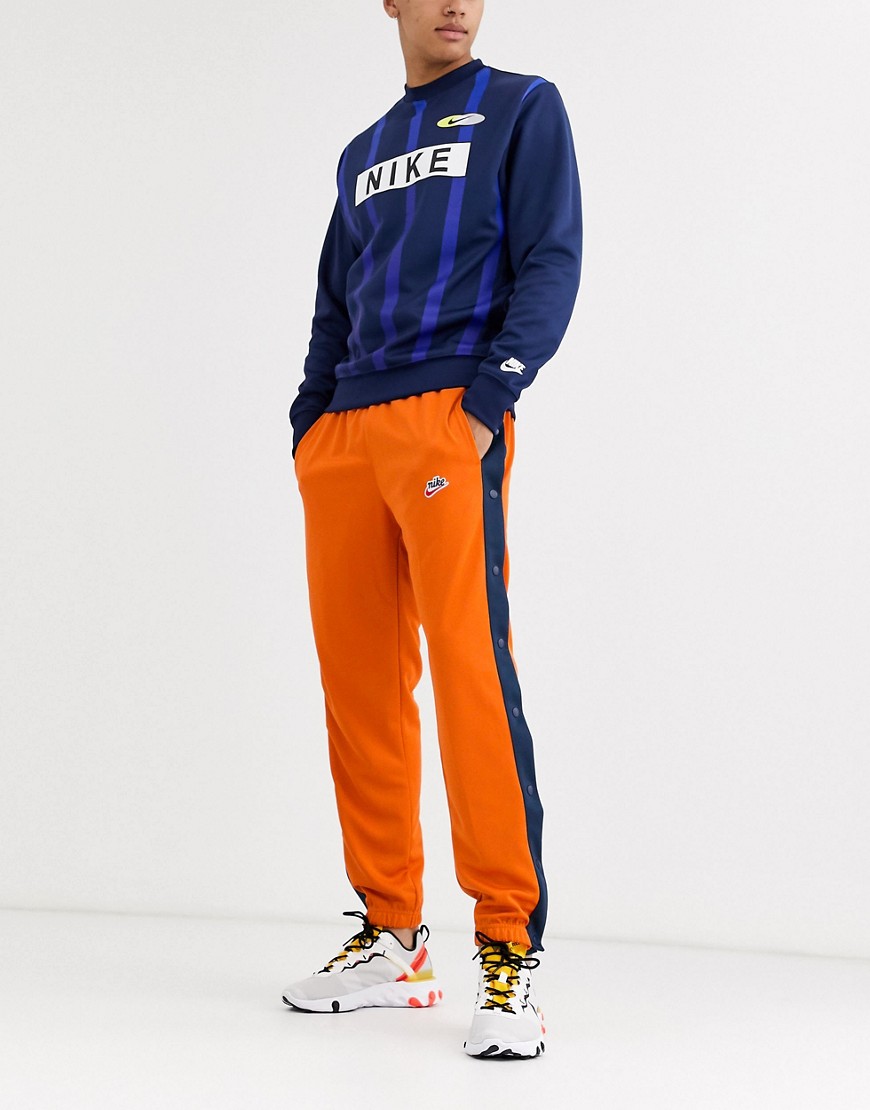 Nike - Heritage popper joggingbukser i orange