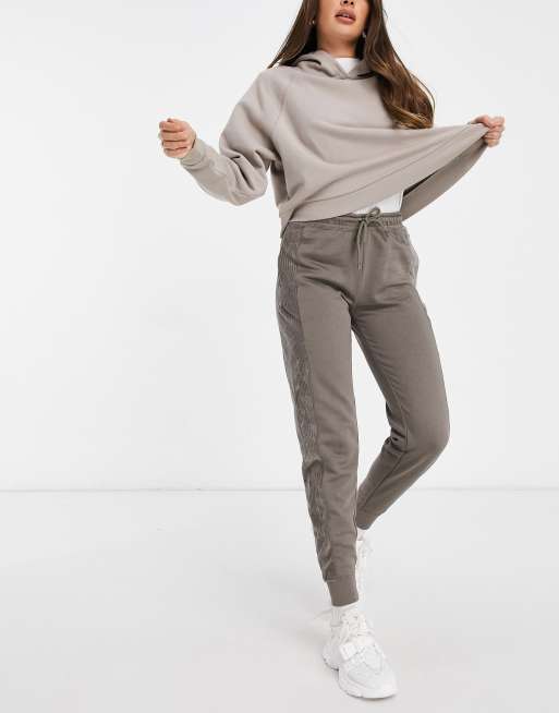 Nike heritage velour cuffed sweatpants in light khak hot sale