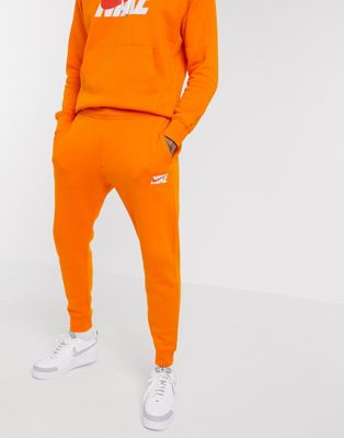 nike grey and orange tracksuit
