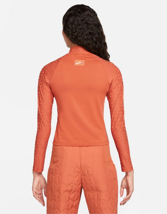 https://images.asos-media.com/products/nike-icon-clash-all-over-logo-print-mock-neck-long-sleeve-top-in-terracota/200627037-3?$n_550w$&wid=550&fit=constrain