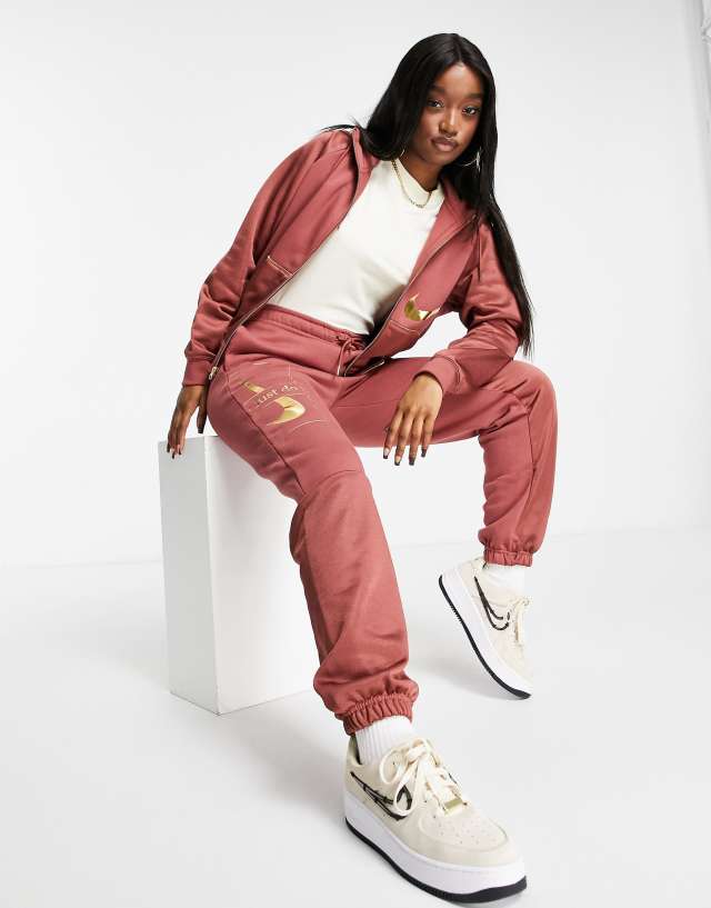 Nike Icon Clash sweatpants in clay red - STONE