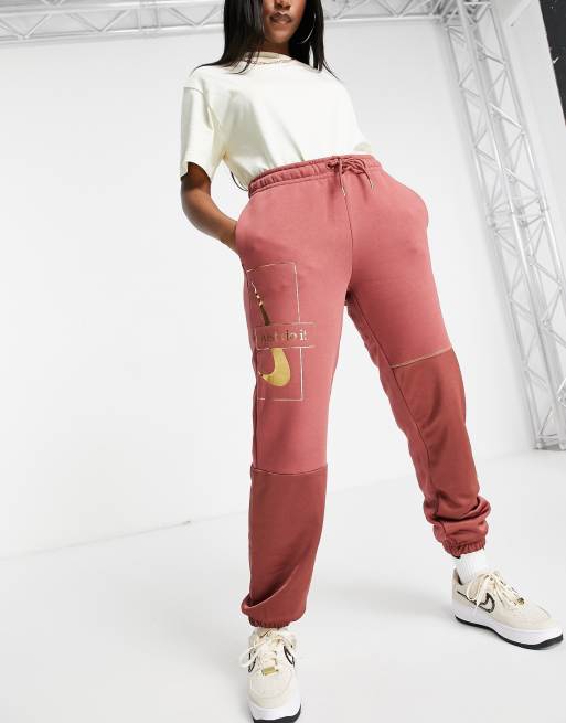 Nike Icon Clash sweatpants in clay red STONE ASOS