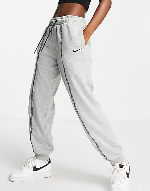 Nike Icon Clash taping cuffed sweatpants in gray heather | ASOS