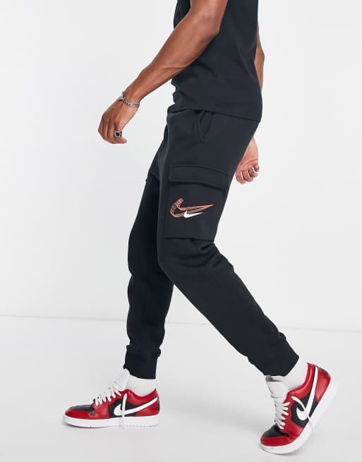 nike jogger en polaire à logo virgule noir