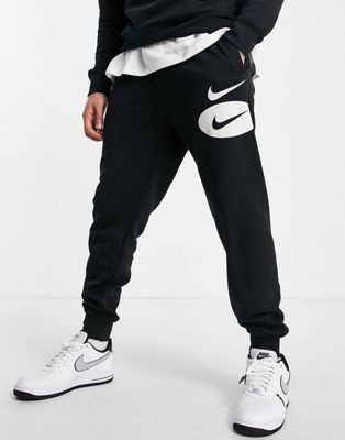 Survêtements Nike - Jogger en polaire à logo virgule - Noir