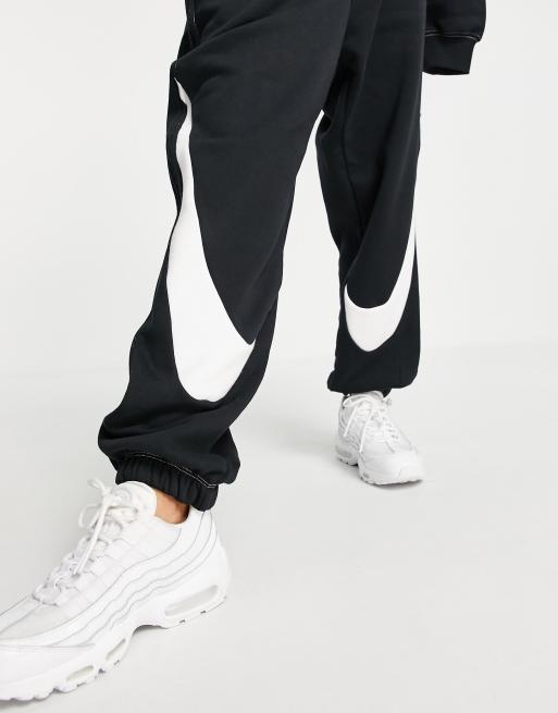 nike jogger en polaire à logo virgule noir