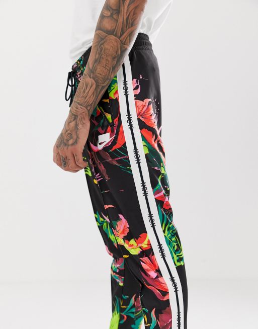 Men's nike sportswear floral best sale track pants