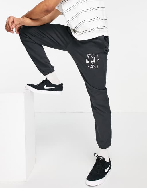 Nike Jogger rétro ample avec logo Noir délavé ASOS