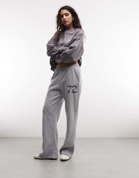 Nike joggers de forro polar Studio, de talle medio y bajo abierto, grises con logo - view 1