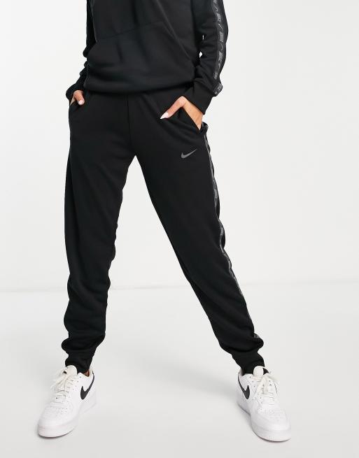 Nike joggers in black with logo tape side seams