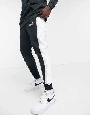 nike overbranded cuffed joggers in black