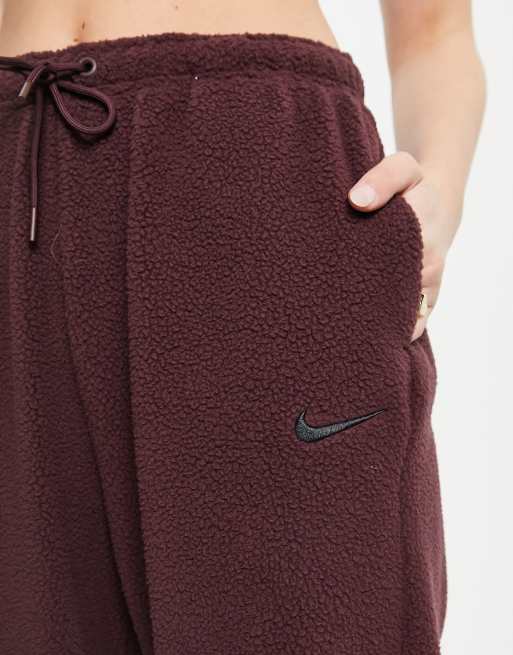 Nike joggers in burgundy