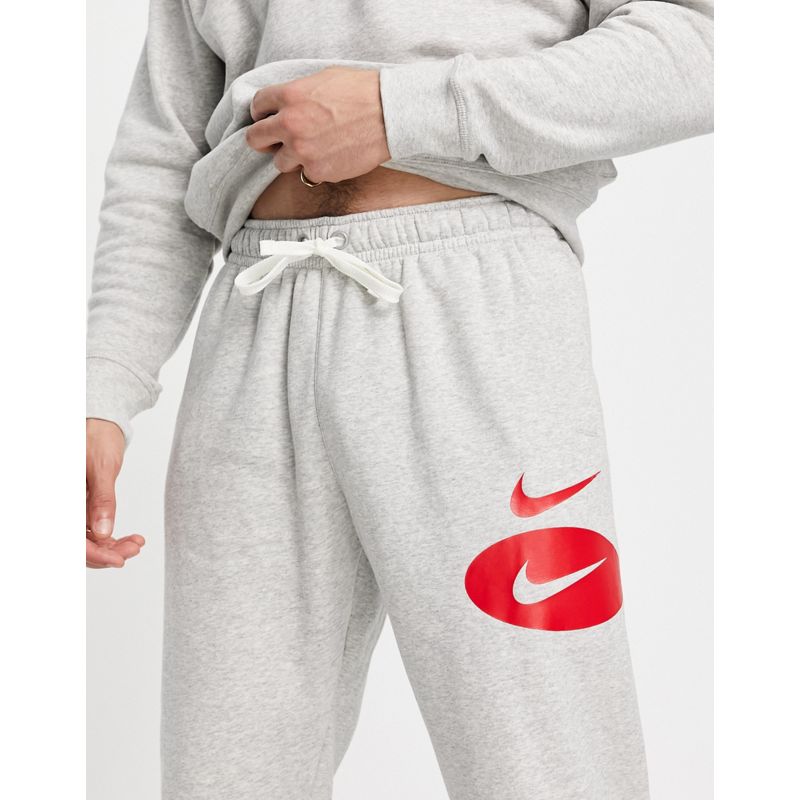 Pantaloni e leggings ocopf Nike - Joggers in pile grigio con logo Nike