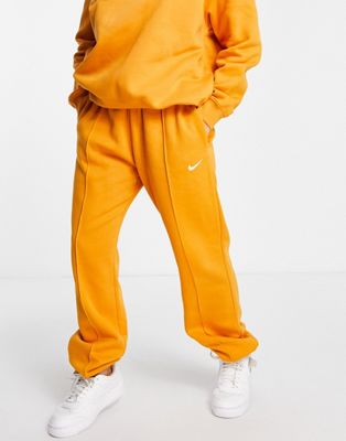 Nike - Joggers oversize avec mini logo virgule - Orange