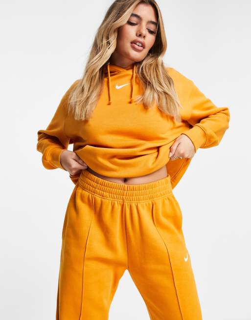 Nike Joggers oversize avec mini logo virgule Orange ASOS