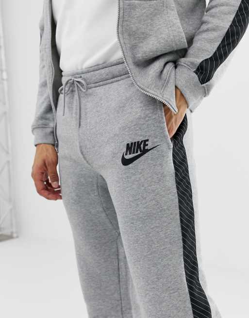 Grey nike joggers with black stripe new arrivals