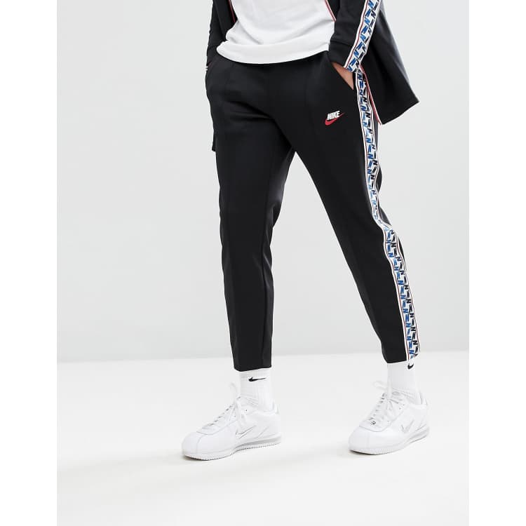 Nike Joggers With Taped Side Stripe In Regular Fit In Black AJ2297-010