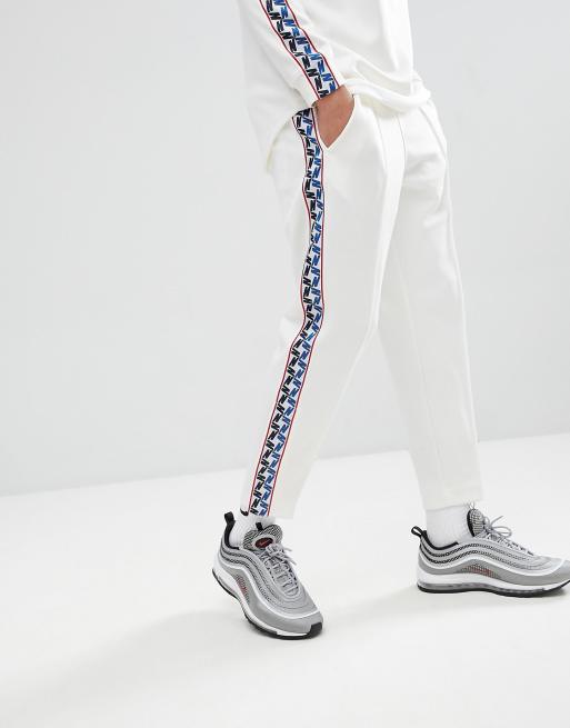 Nike tracksuit best sale white stripe