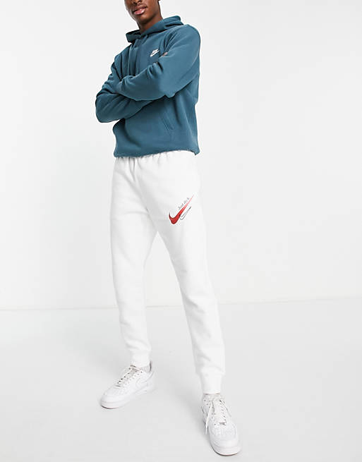 kleurstof Discrepantie blad Nike - Joggingbroek met aansluitende boorden en logo in wit met rood | ASOS