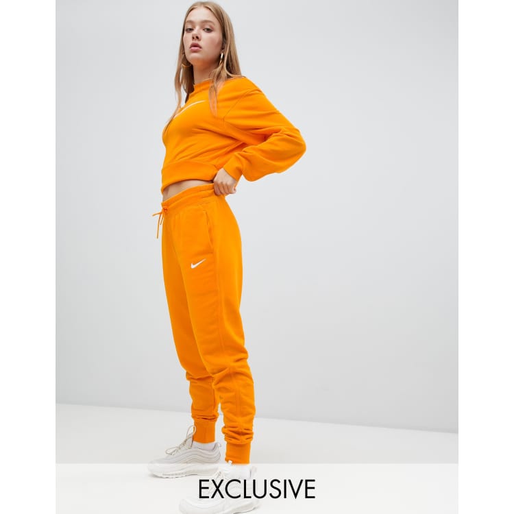 Nike Jogginghose in Orange exklusiv bei ASOS