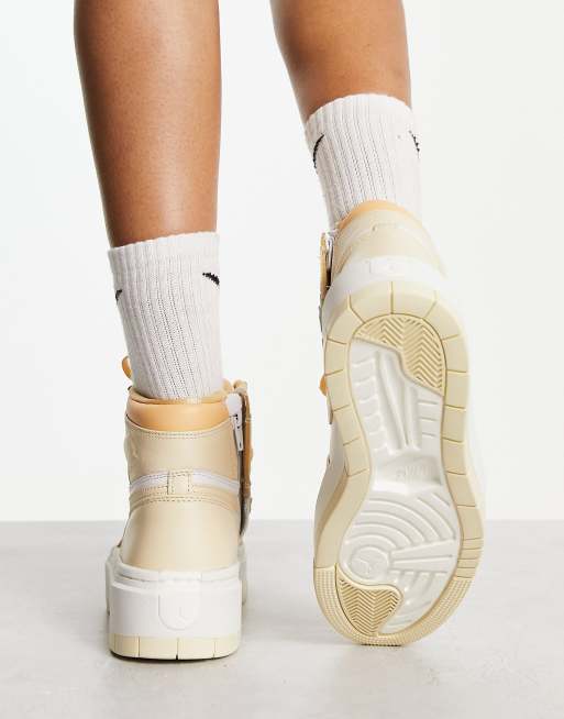 Nike Jordan 1 Elevate High sneakers in gold and white