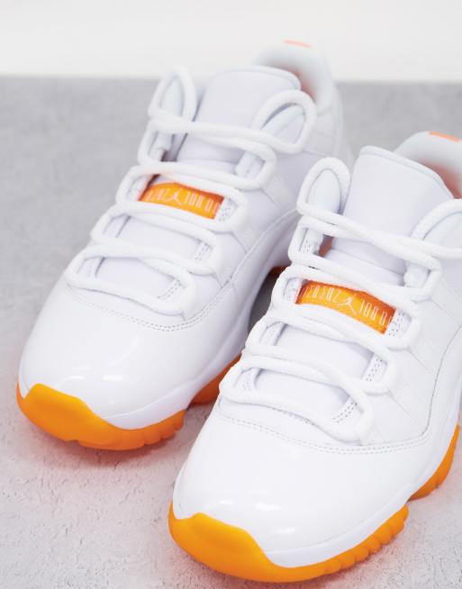 Orange and white jordan on sale 11s