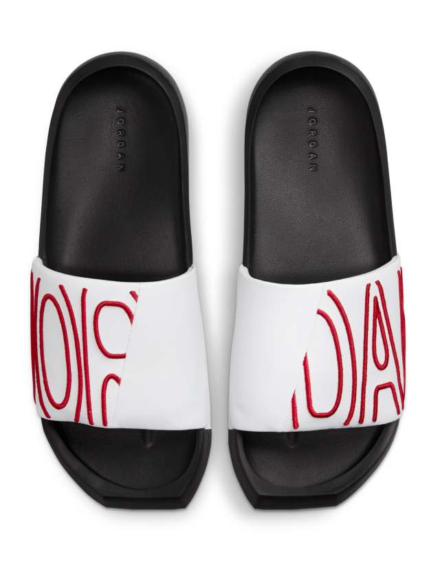 Nike Jordan Nola sliders in white/gym red