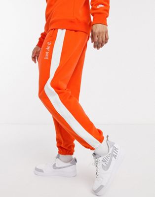 orange sweatpants nike