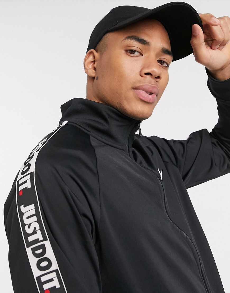 Nike - Just Do It - Giacca sportiva nera con zip e fettucce in maglia di poliestere-Nero