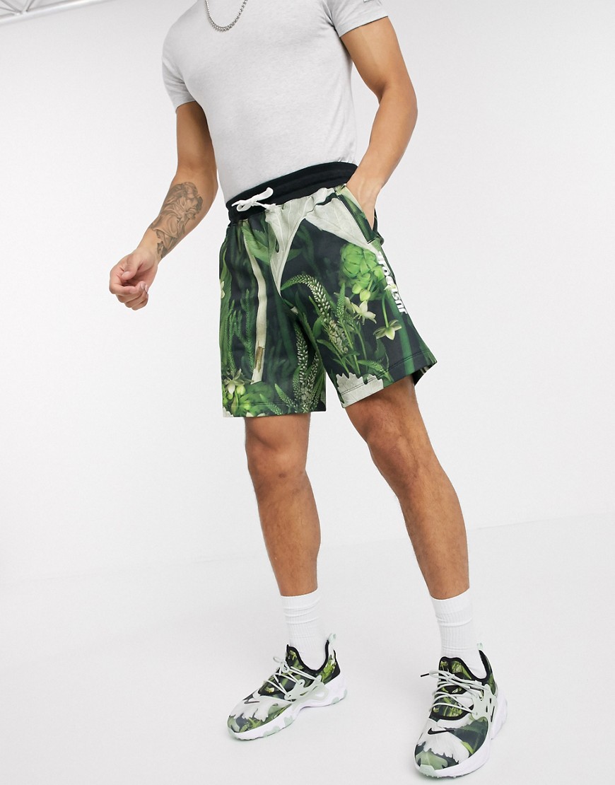 Nike Just Do It shorts in tropical leaf print-Green