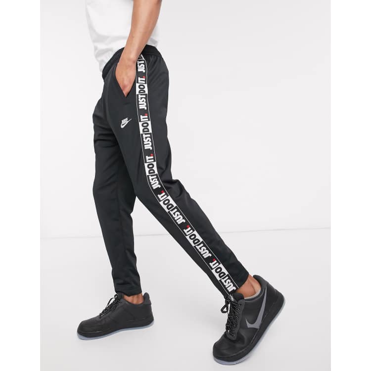 Chaqueta Festival Enseñando Nike Just Do It taping cuffed joggers in black | ASOS