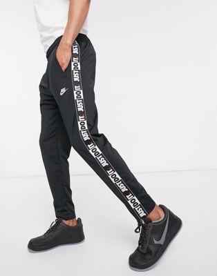 nike taping skinny fit joggers in black